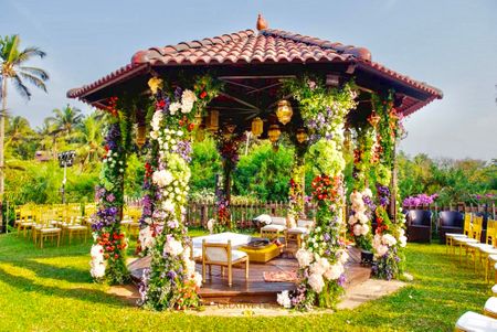 Dome-shaped mandap with floral settings.