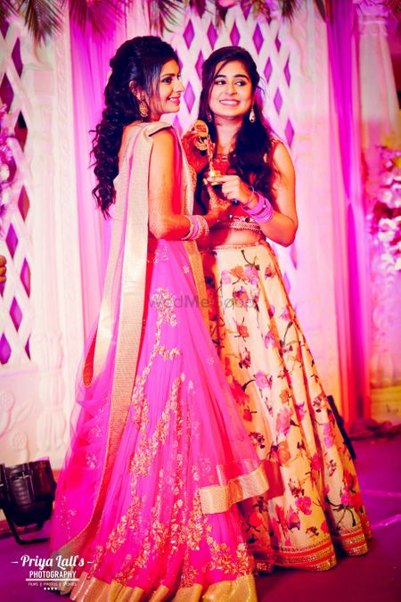 Photo of Bright pink and light pink floral lehengas
