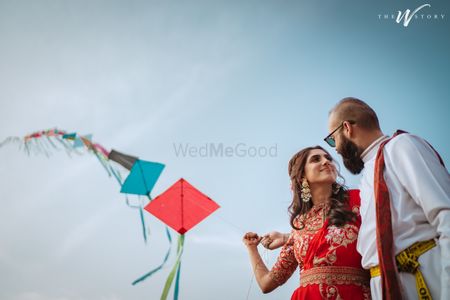 Bride and groom flying kites on their mehendi.