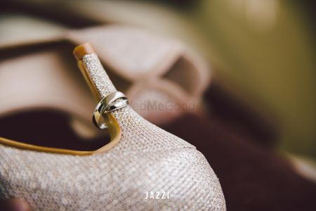 Photo of Engagement rings on heel on bridal shoe