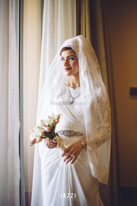 Photo of White Wedding Gown with Hijab type Veil