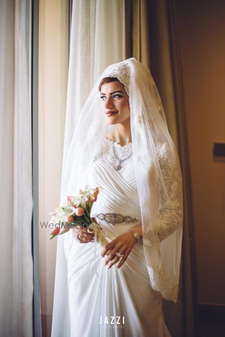 Photo of White Wedding Gown with Hijab type Veil