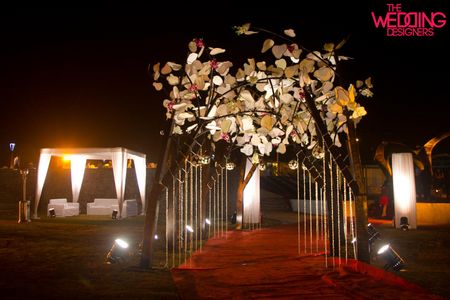 Entrance tree of life decor at night made from all white paper flowers
