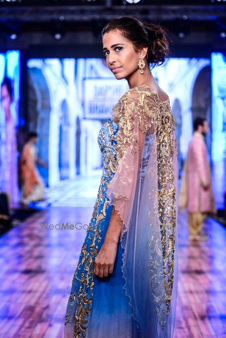 Photo of Shaded blue gown with sheer net cape with sequin work