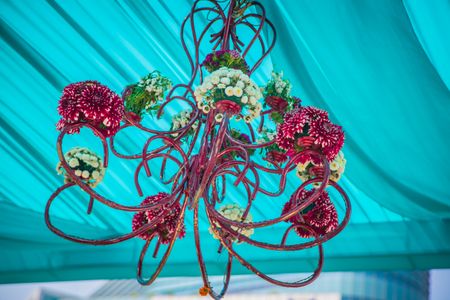 Blue tent with floral pink chandelier