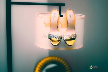 Bridal shoes photography on lamp