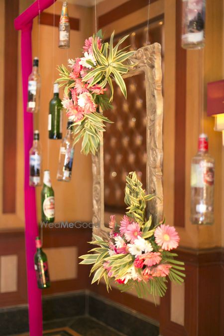 Photobooth with frame and recycled alcohol bottles