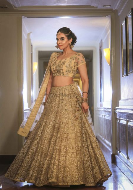 Gold net lehenga for engagement with sequin work