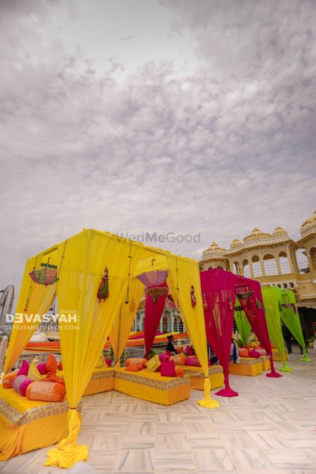 Colourful canopies for seating at destination wedding