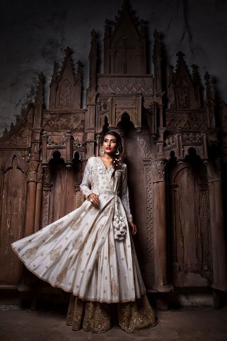 Photo of White Anarkali with gold sequin sharara