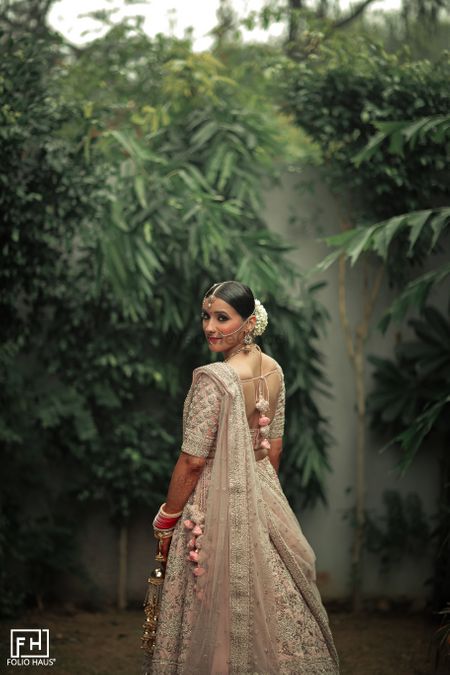 Photo of Bride looking backward and posing.
