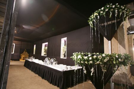 Photo of black white and green theme with side tables