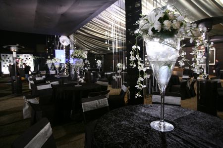 Photo of Tall table centerpieces made out of large cocktail glasses