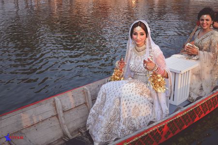 Bridal entry in a shikara boat over water