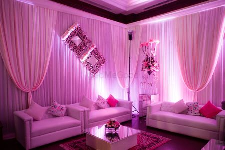 Photo of lavender and white drapes with white and pink cushions