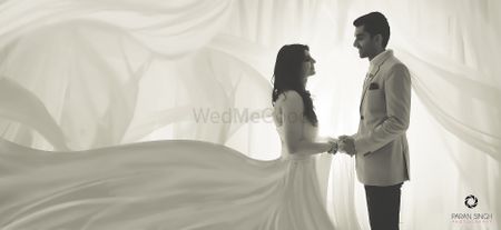 Photo of Pre wedding shoot couple portrait with flowing gown