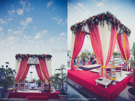 Light pink and red outdoor mandap