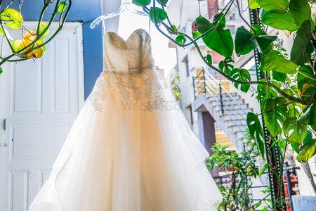 Off white wedding gown on hanger