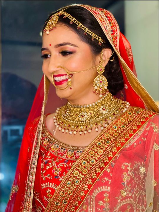 Free Photos - A Beautiful Indian Woman Wearing Traditional Jewelry,  Including Large Earrings And A Nose Ring. Her Outfit And Jewelry Showcase  Cultural Elements From India, And She Is Looking Directly Into