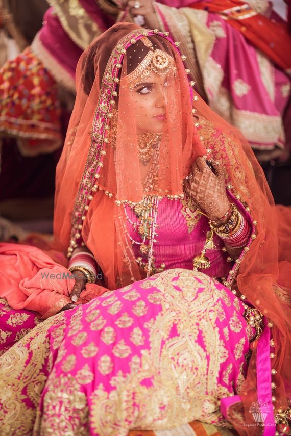 orange and pink bridal lehenga