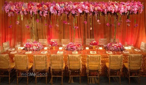 Photo Of Pink And Gold Theme Table Setting With Floral Canopy