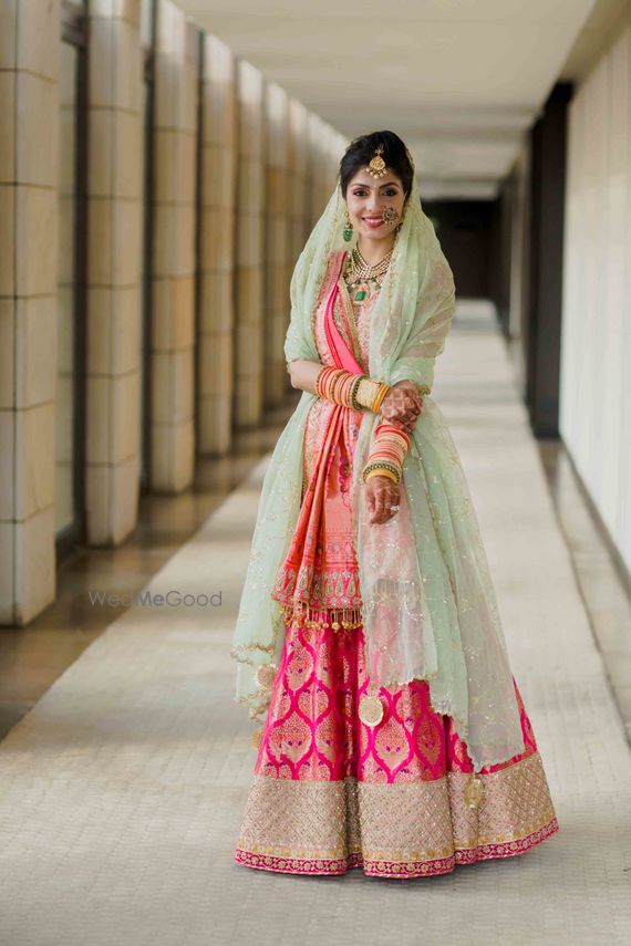 pink and green bridal lehenga