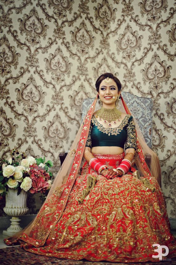 red and green bridal lehenga