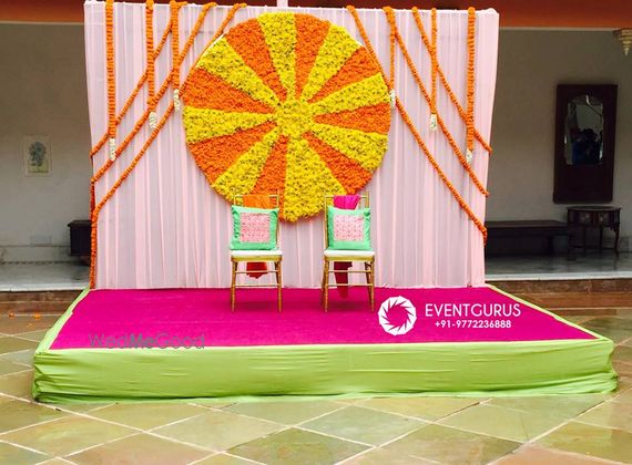 Photo Of Colourful Mehendi Decor With Genda Phool Stage Wall