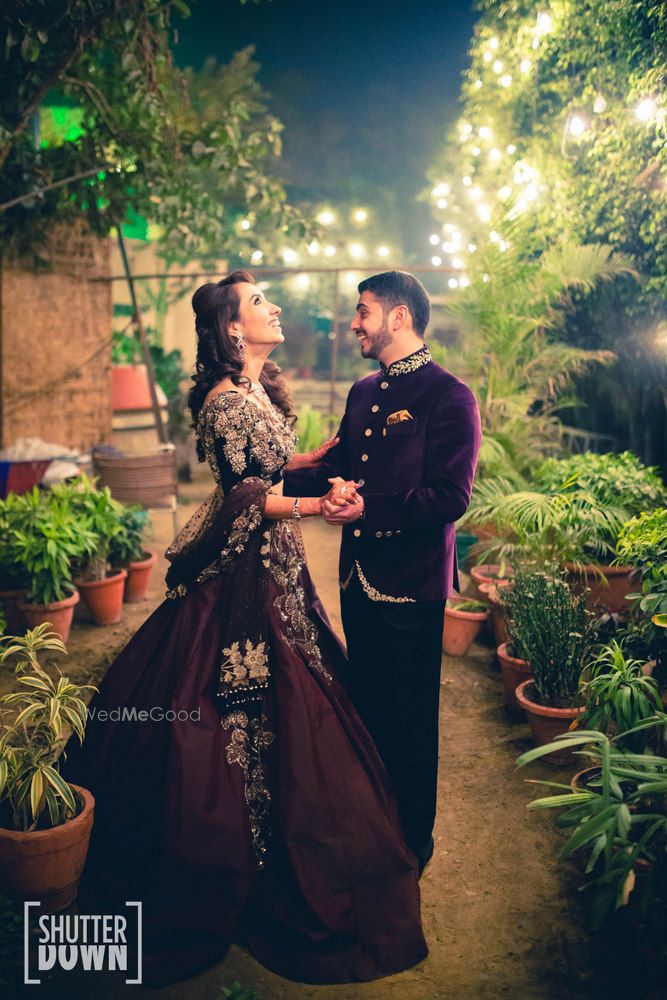 Photo of Deep wine colored bride and groom portrait