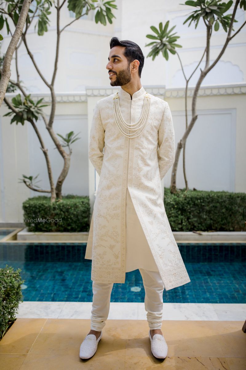 Photo of Groom dressed in an ivory sherwani