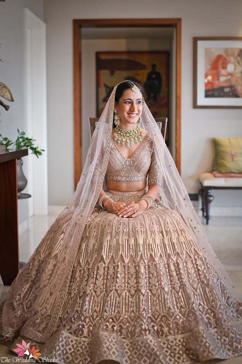Nomi Ansari. The beautiful #bride Durezehra Naqvi wears our signature long  tulle gown with an embellished #lehenga and scalloped dupatta in #Florida  #USA