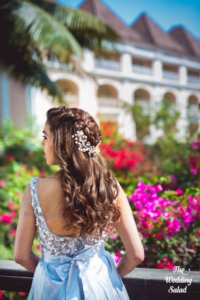 Photo of Open hairstyle with embellished pin for engagement