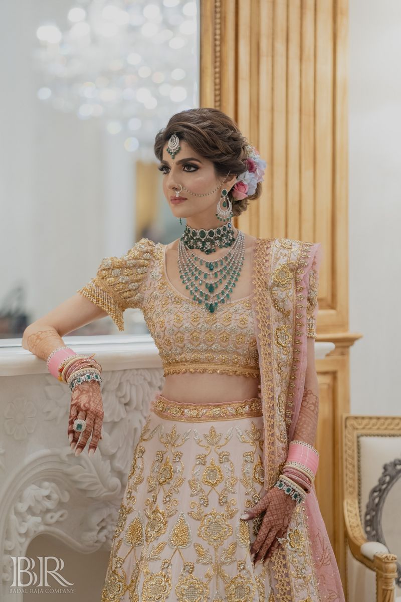 Bride In Gold Lehenga With Emerald Jewellery And Broad Matha Patti | Golden  bridal lehenga, Bridal jewellery indian, Fashion