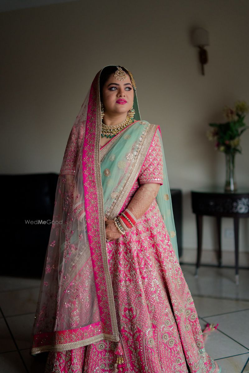 Photo of Punjabi bride in pretty pink lehenga for wedding