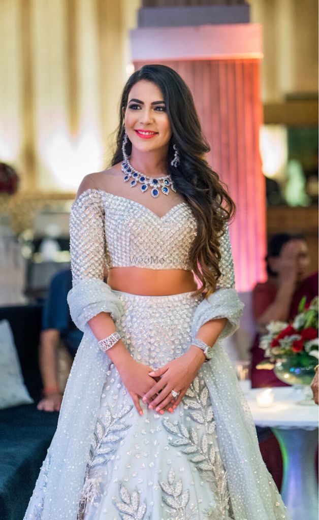 Photo of Pretty off shoulder blouse with silver lehenga