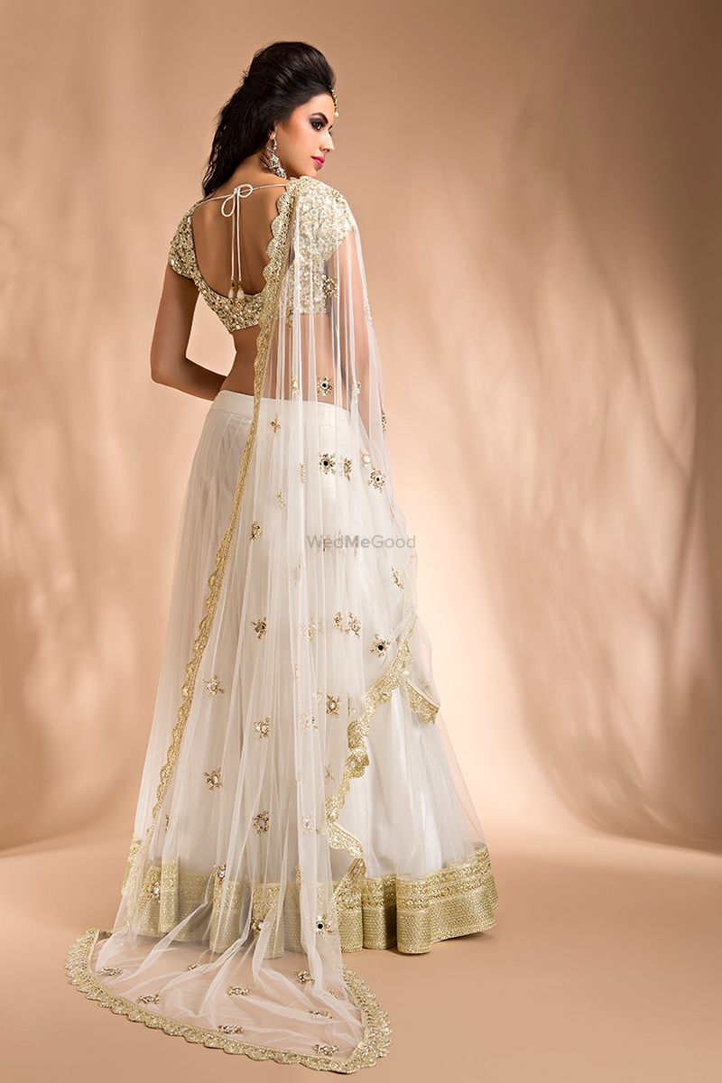 Floral Embroidered Yellow Blouse with White Mirror Lehenga and Net  Embroidered Dupatta | Vogue India