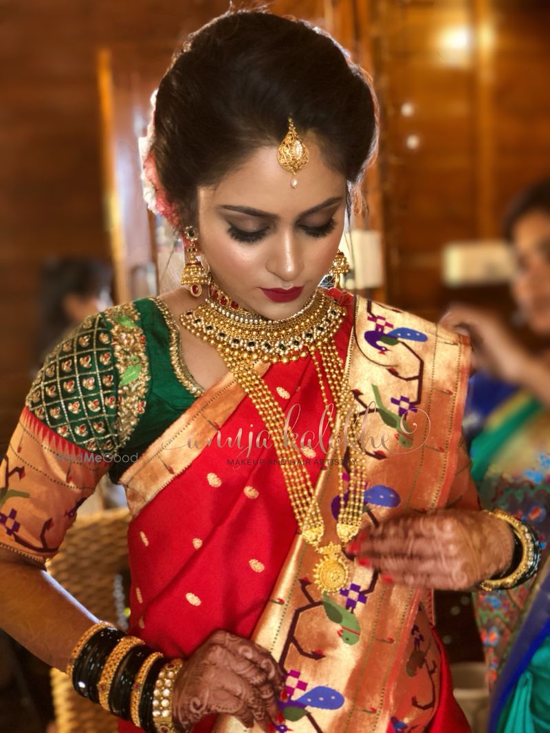 Bridal red paithani saree with traditional maharashtrian 
