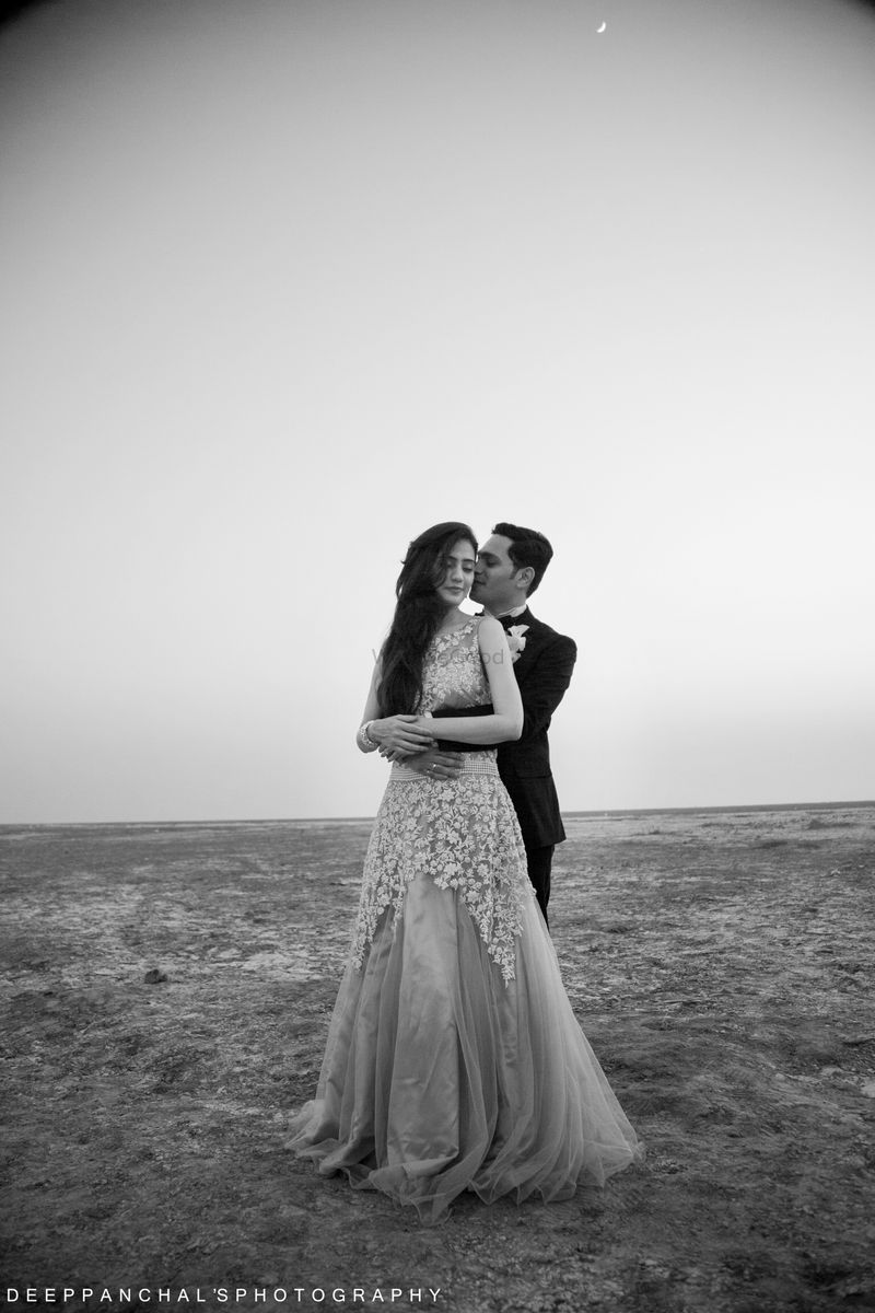 Photo of Romantic black and white pre wedding shoot in gown and tuxedo