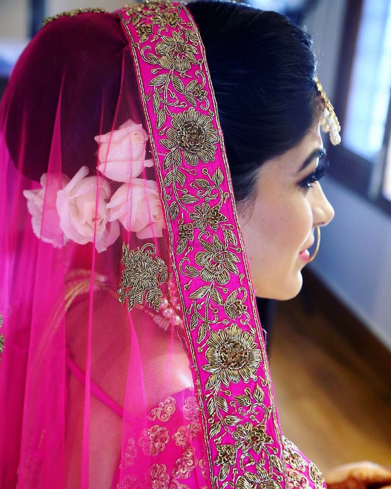 Photo of Hairstyle for pink lehenga with white flowers
