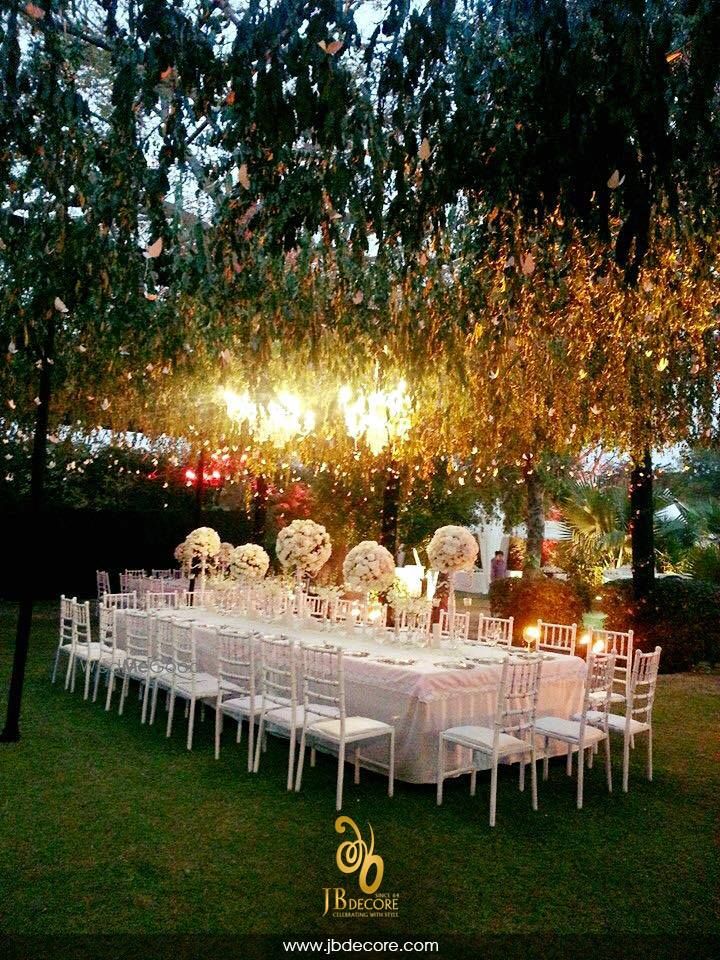 Photo of Magical table setting in white with suspended florals