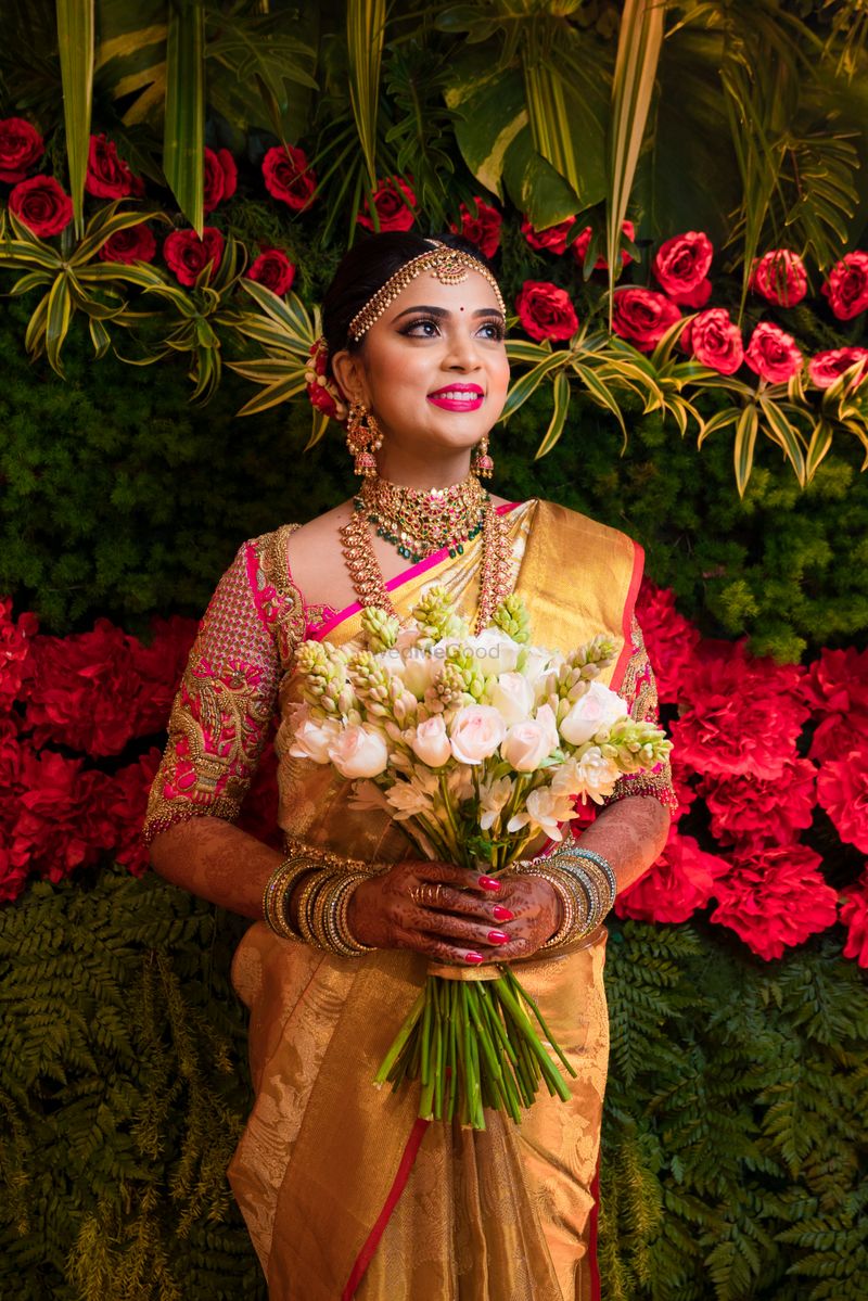 Photo Of South Indian Bridal Look Holding Bouquet