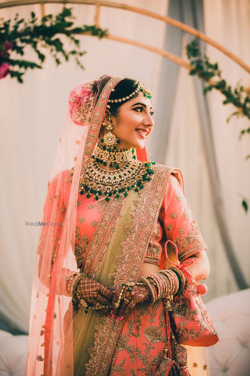 Photo of Peach lehenga with green 