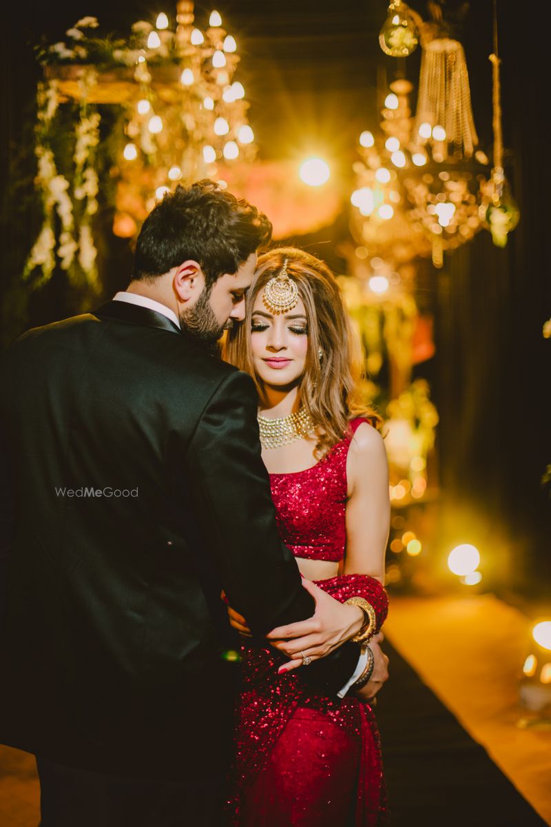 red saree and black suit