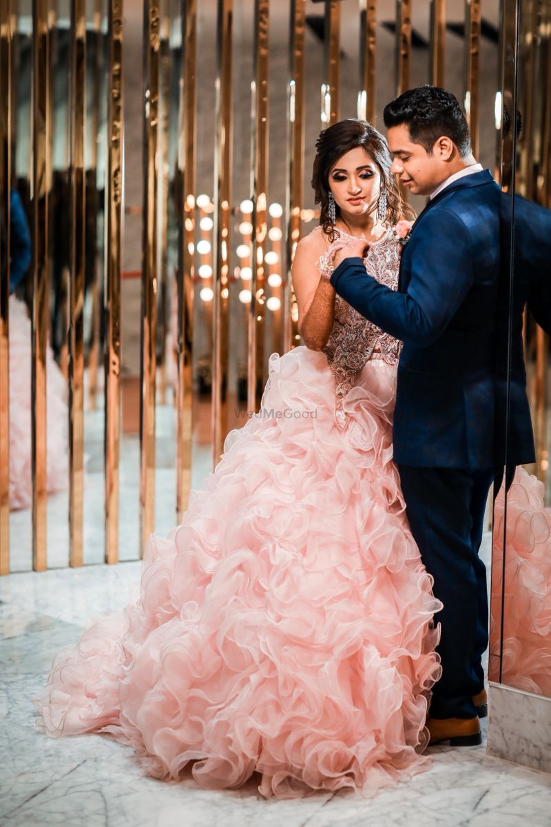 Photo of Light pink ruffled gown for engagement