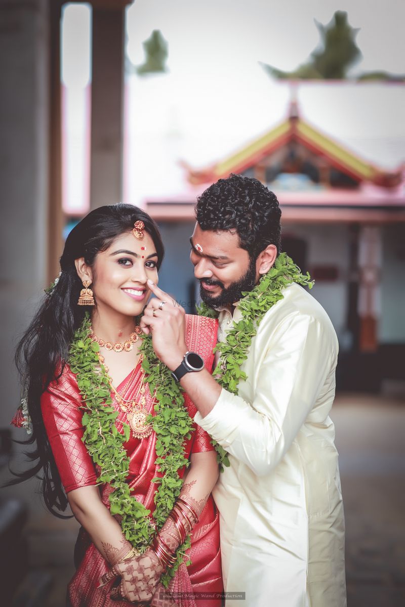 South Indian couple standing back to back Stock Photo - Alamy