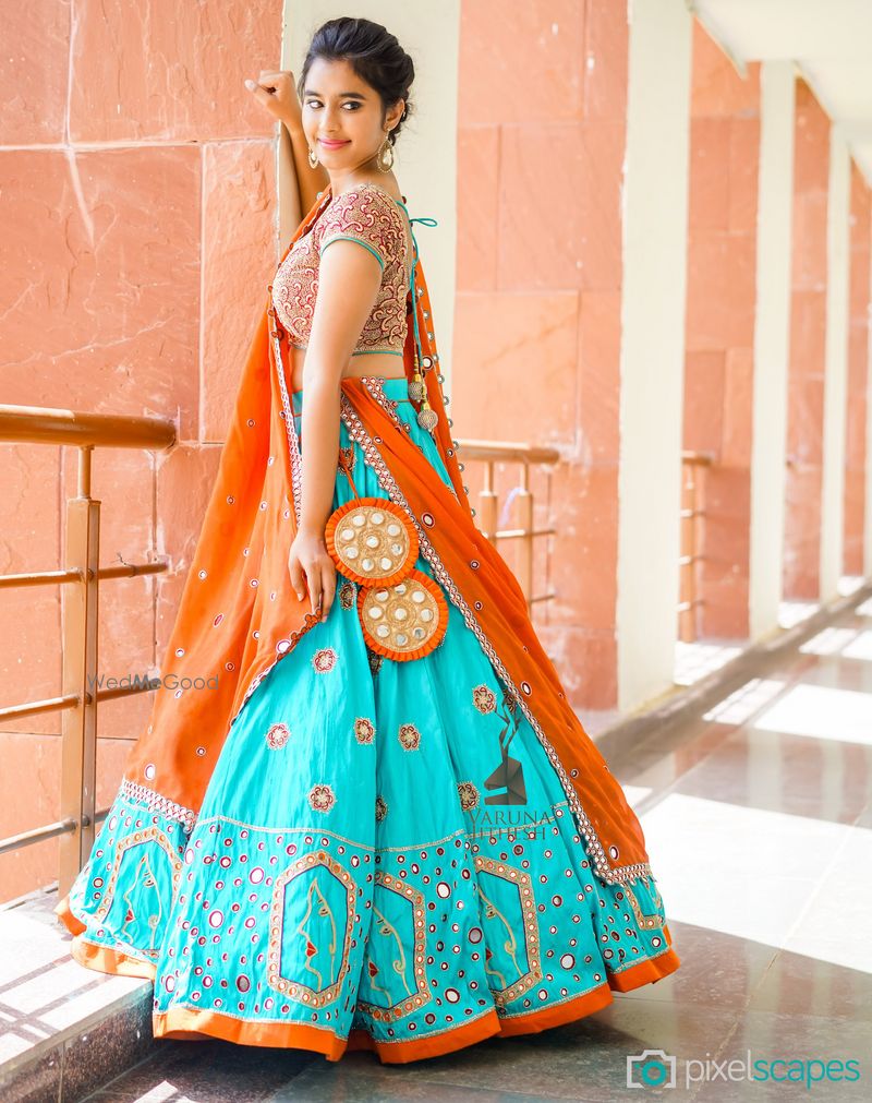 Photo of Turquoise and Orange Lehenga