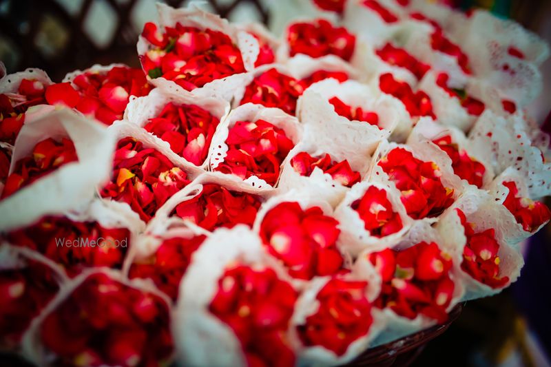 Photo of Rose petals in paper cones
