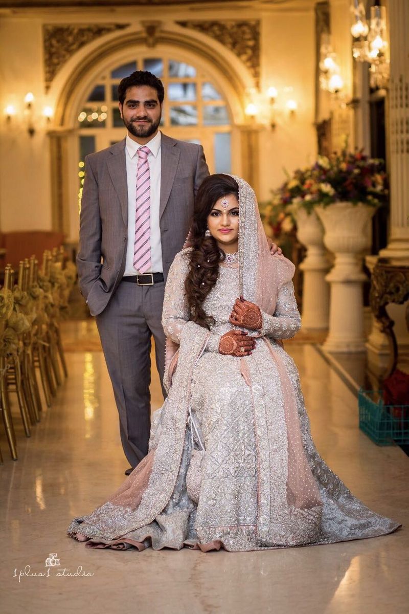 Photo of Muslim wedding couple portrait in grey