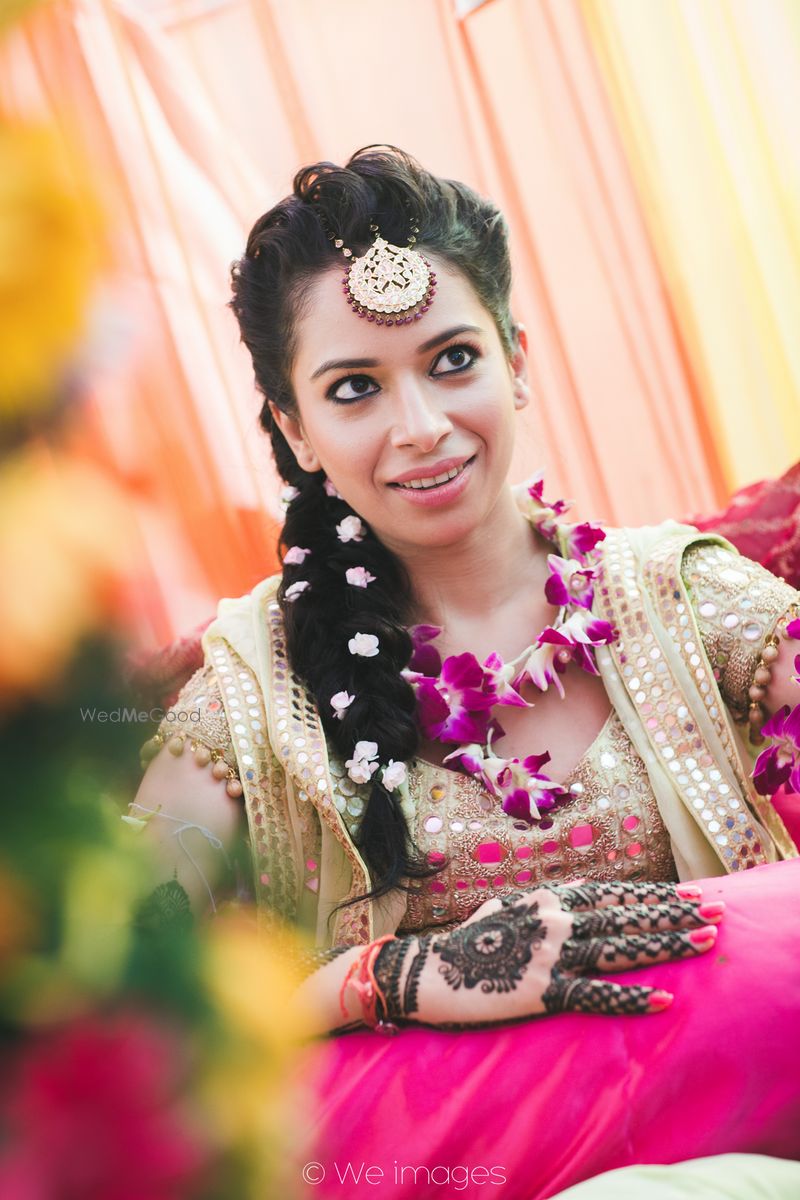 Photo of Bride with Mehendi and Orchid Floral Jewellery and Hair Photo of Bride with Mehendi and Orchid Floral Jewellery and Hair