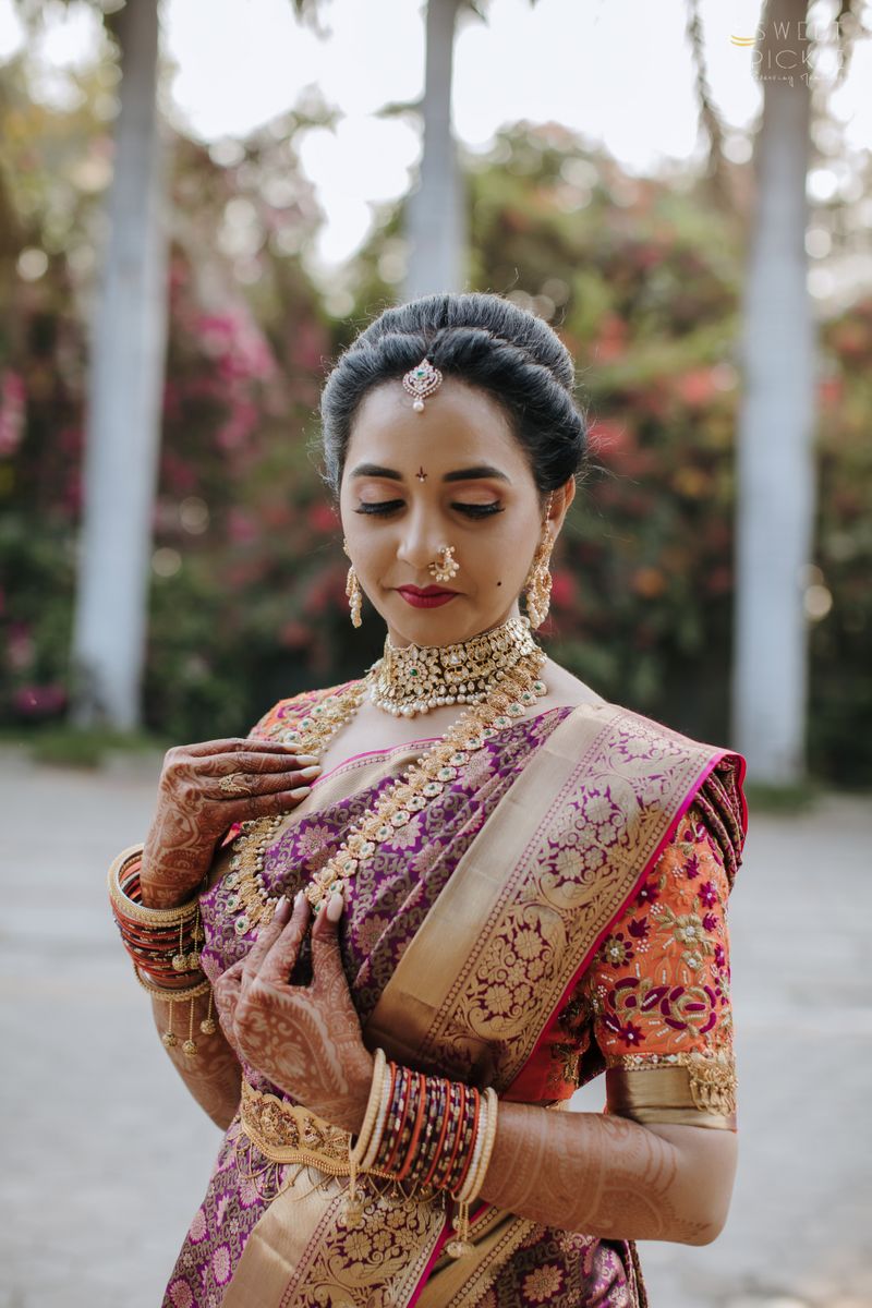 Photo of unique bridal look for south indian bride with maroon saree